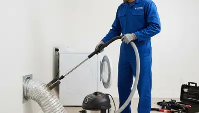 Technician cleaning dryer vent for improved airflow and safety in Durham, NC home